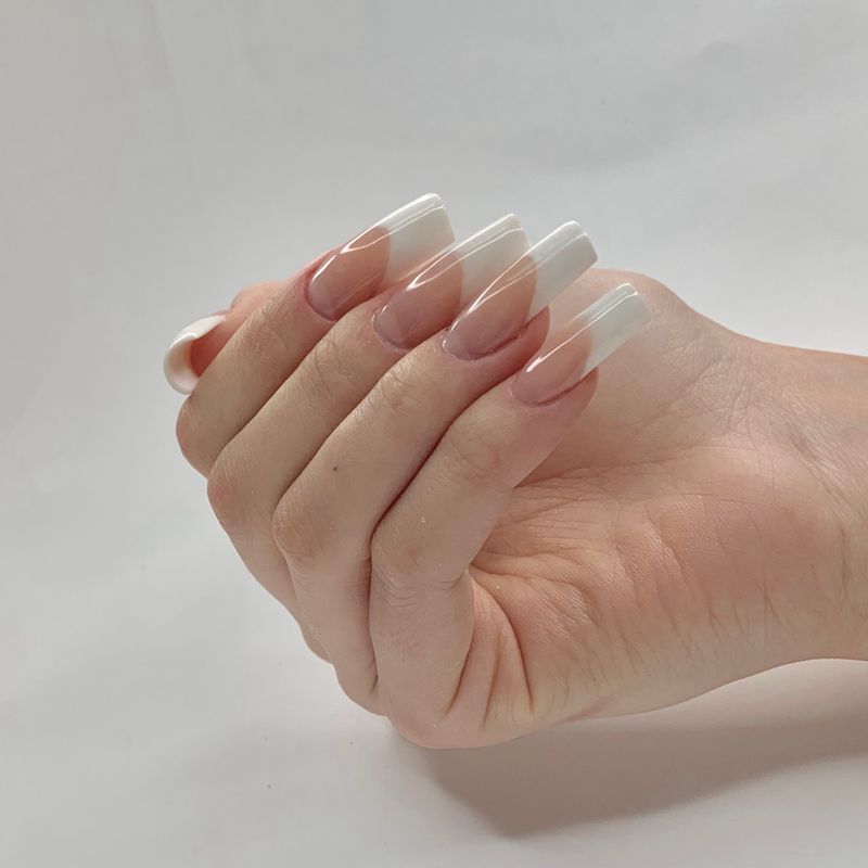 Close-up of a glossy classic manicure.