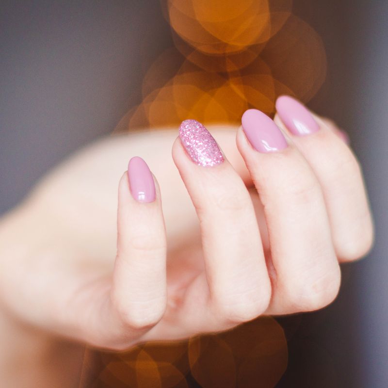Close-up of sculpted acrylic nails.