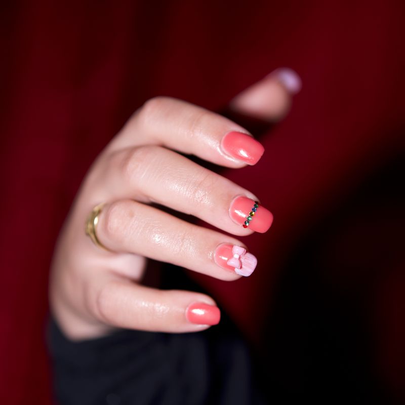 Close-up of detailed hand-painted nail art.
